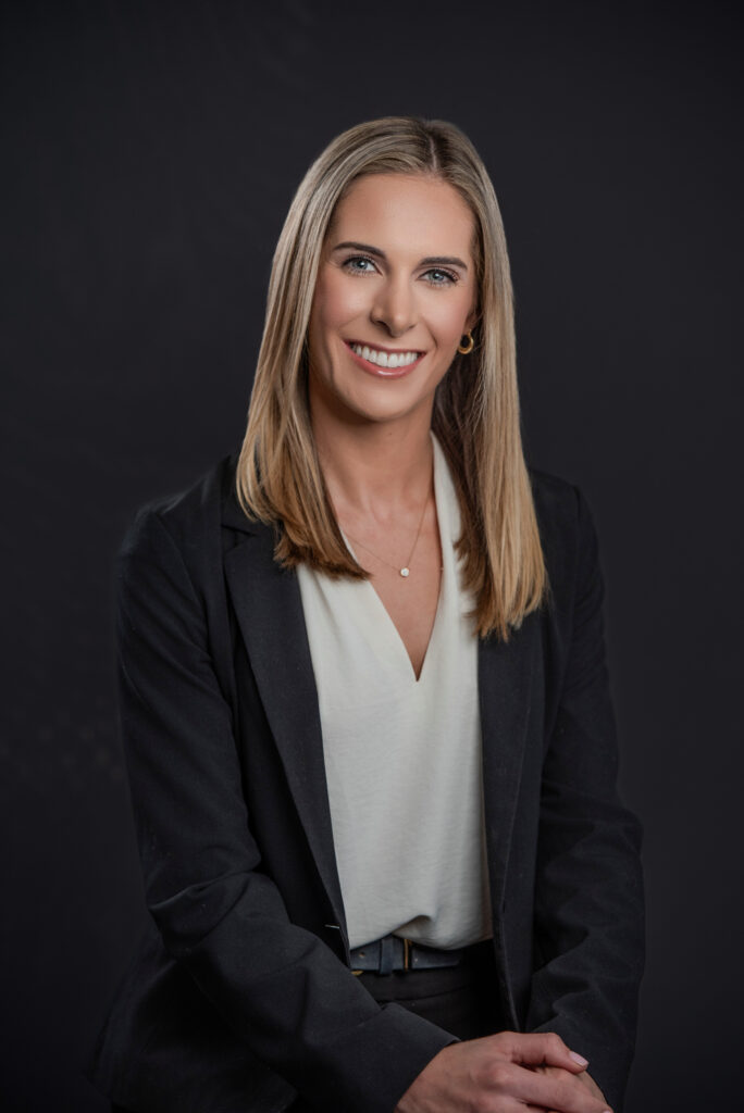 Studio headshot of a legal professional photographed with a natural expression and professional styling.