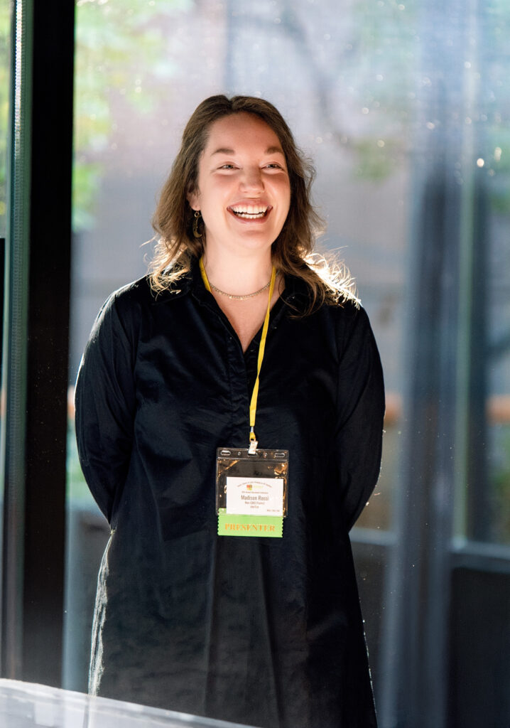 Corporate conference speaker presenting during a professional networking event in Southern California