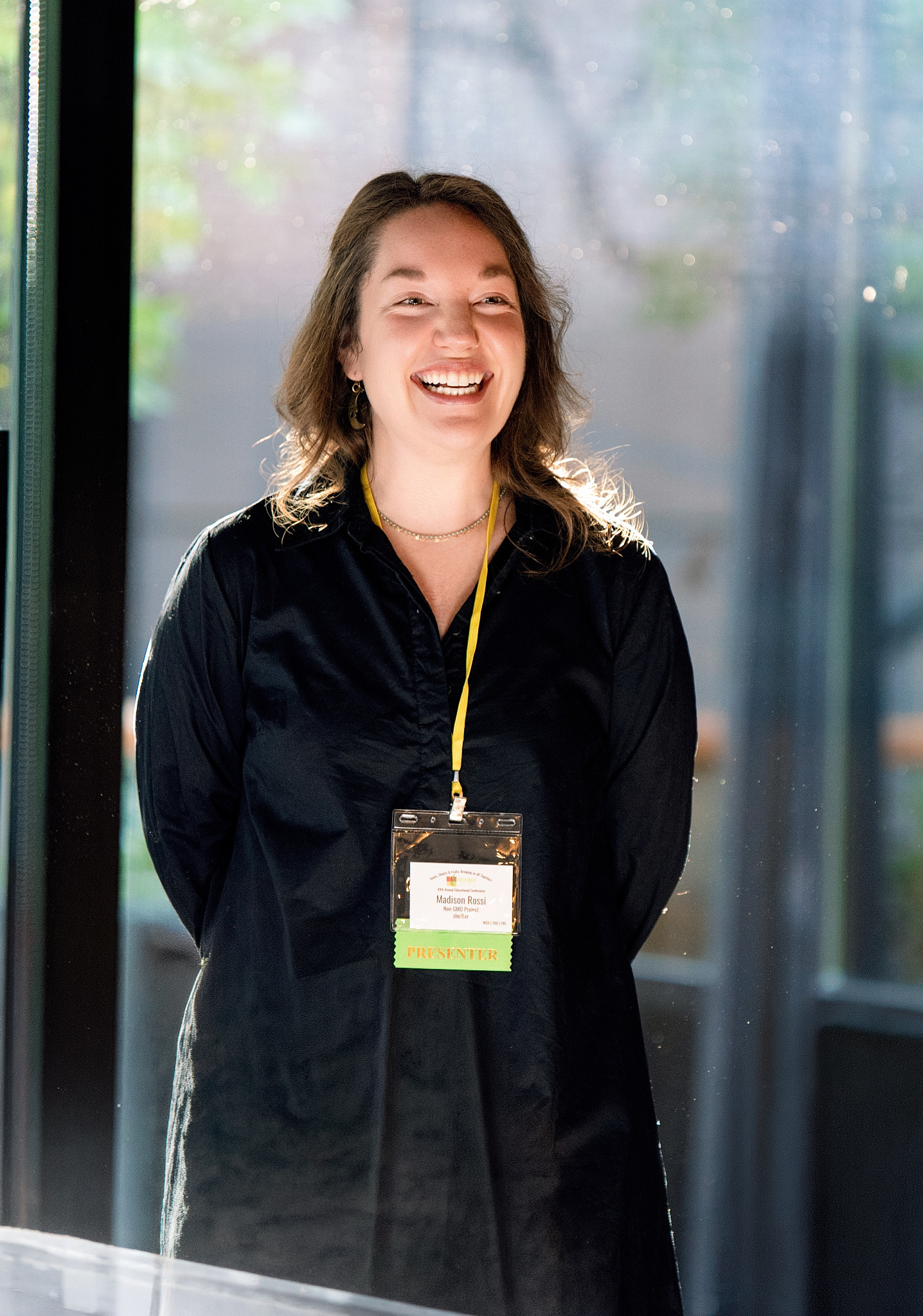 Corporate conference speaker presenting during a professional networking event in Southern California