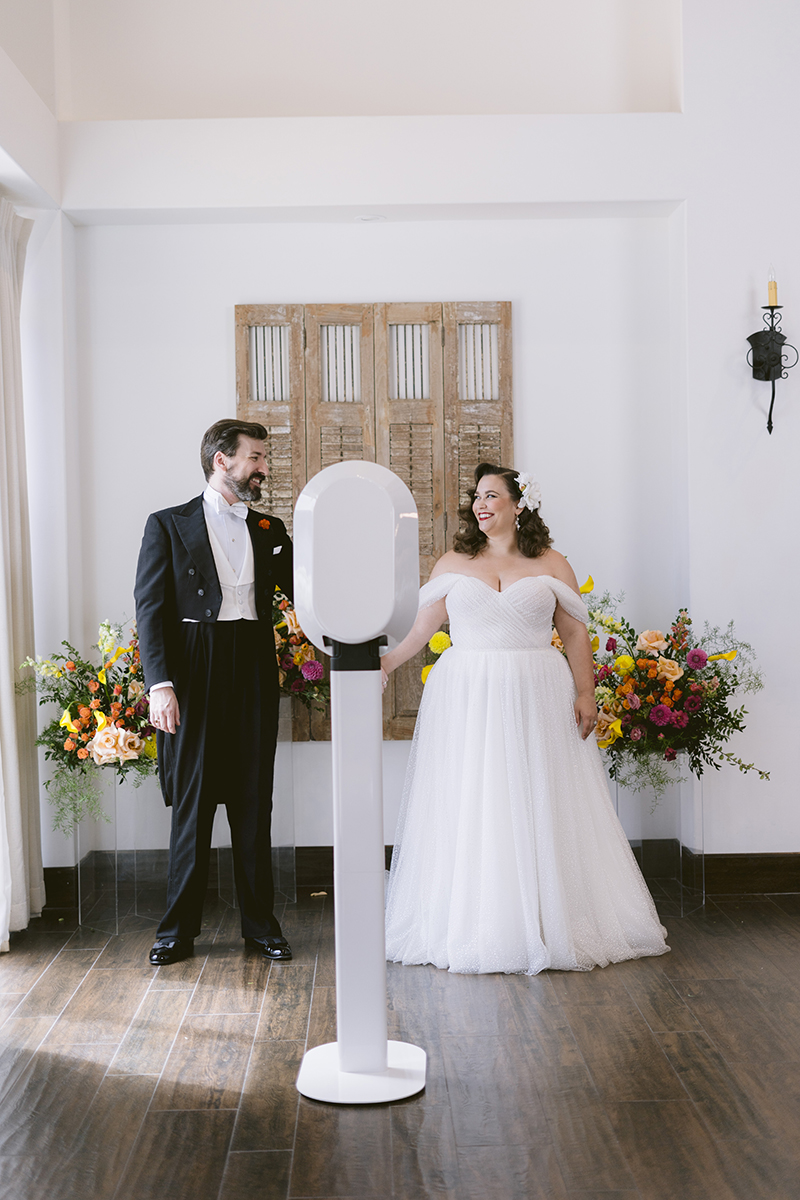 Bride and groom at social booth